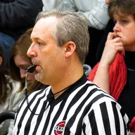 Chris Webster officiating a basketball game